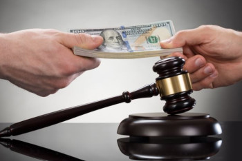 Фотография к новости:  В получении взяток подозревают полицейских в нескольких областях РК