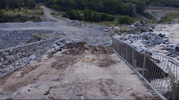 Фотография к новости: Размытую селем дамбу на плотине Талгар восстановили