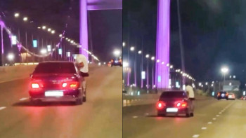 Фотография к новости: Ради лайков? В Семее парень прокатился на двери автомобиля и попал в полицию