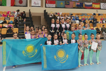 Фотография к новости: Юные казахстанские гимнастки с триумфом выступили в Сингапуре