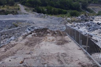 Фотография к новости: Размытую селем дамбу на плотине Талгар восстановили